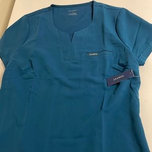 Brand new tag on Jaanuu Caribbean blue scrub top